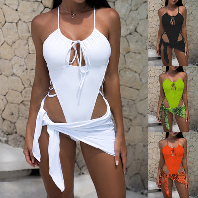 Women's neon green one-piece swimsuit with a tie-front halter neck and side cut-outs, paired with a matching snake print sarong. - Image 26