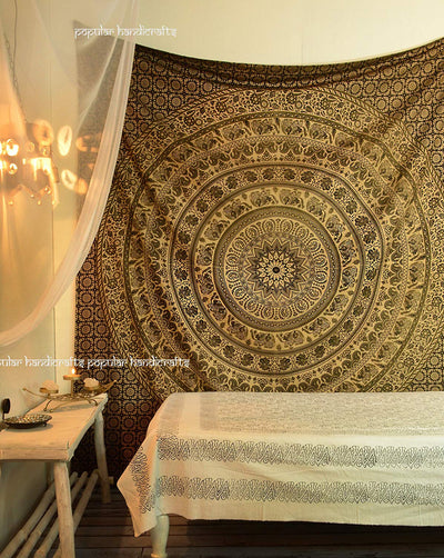 Gold and blue mandala tapestry with elephant and floral patterns, hung above a white quilted bed. - Image 8