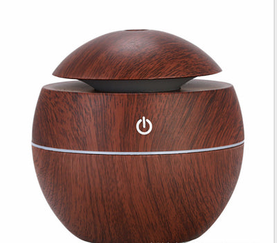 Dark wood grain aroma diffuser and humidifier with a silver power button and accent line. - Image 7