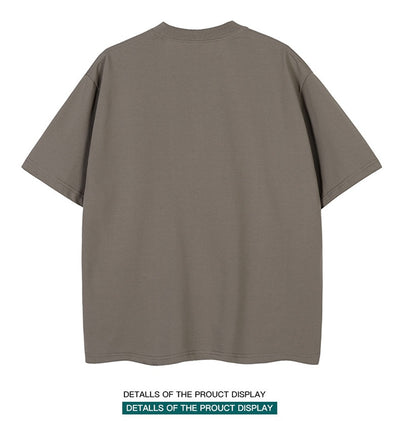 Moss green short-sleeve cotton t-shirt with a crew neck and a relaxed, oversized fit. - Image 16