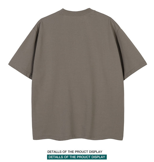 Moss green short-sleeve cotton t-shirt with a crew neck and a relaxed, oversized fit. - Image 16
