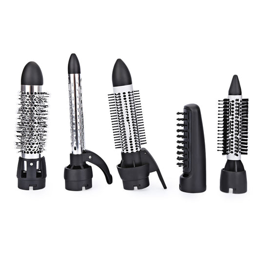Seven-in-one hair dryer set with white and purple main unit and multiple black styling attachments in an open box. - Image 2