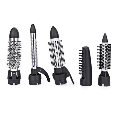 Seven-in-one hair dryer set with white and purple main unit and multiple black styling attachments in an open box. - Image 2