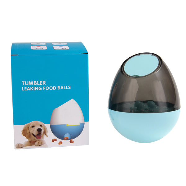 Orange and blue interactive pet food dispenser toy with multiple tiers and white balls, next to its black packaging.