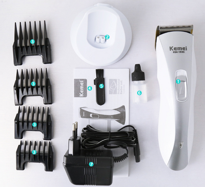 White and silver Kemei KM-1830 electric hair clipper with a charging base on a light background. - Image 6