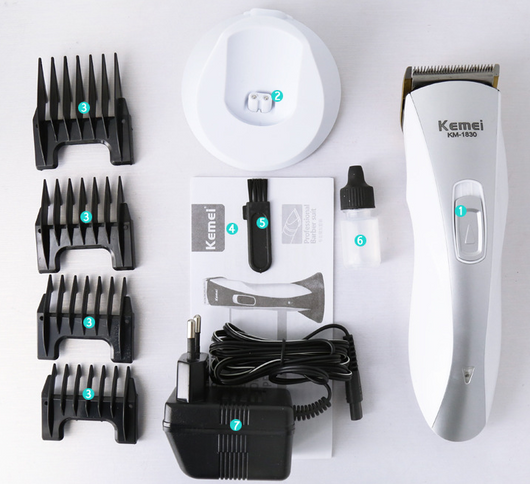 White and silver Kemei KM-1830 electric hair clipper with a charging base on a light background. - Image 6