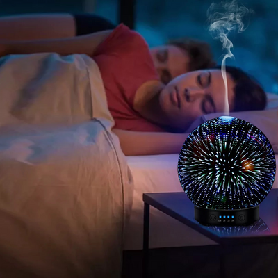 Spherical 3D aromatherapy essential oil diffuser with 7 LED color lighting modes and a black base. - Image 4