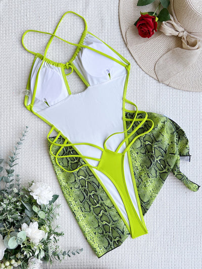 Women's neon green one-piece swimsuit with a tie-front halter neck and side cut-outs, paired with a matching snake print sarong. - Image 42