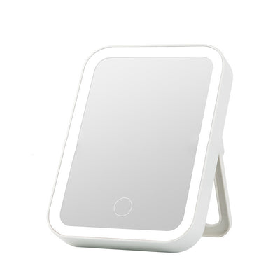 Pink LED makeup mirror with a rectangular shape, built-in lights, and a touch-sensitive power button. - Image 4