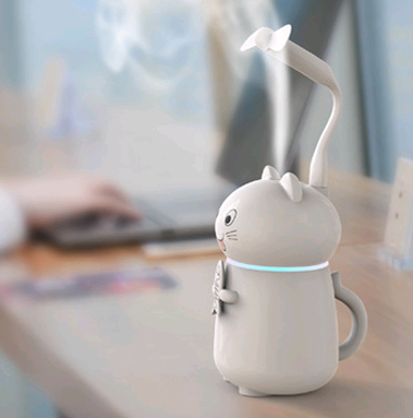 White cartoon cat humidifier with a pink tongue, black eyes, and whiskers, holding a fish skeleton, with a glowing blue light band. - Image 6