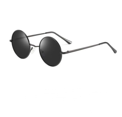 Round vintage sunglasses with gold metal frames and dark black lenses, shown at an angle on a white background.