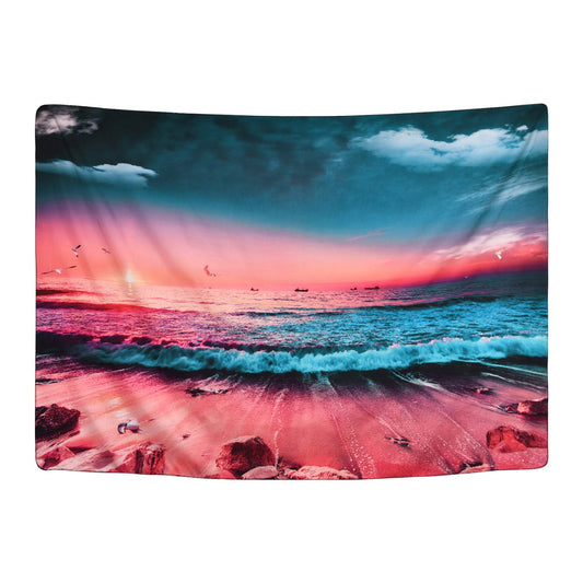 Vibrant sunset beach tapestry with crashing blue waves, orange and red sky, sandy shore, and distant boats.