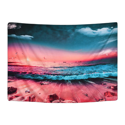 Vibrant sunset beach tapestry with crashing blue waves, orange and red sky, sandy shore, and distant boats.