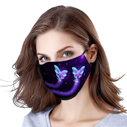 Black cotton face mask with a glowing pink butterfly and blue abstract pattern, worn by a woman. - Image 12
