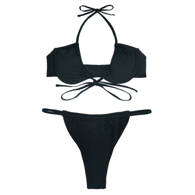 Black two-piece string bikini with a ruched underwire top and matching string bottom, modeled outdoors. - Image 3
