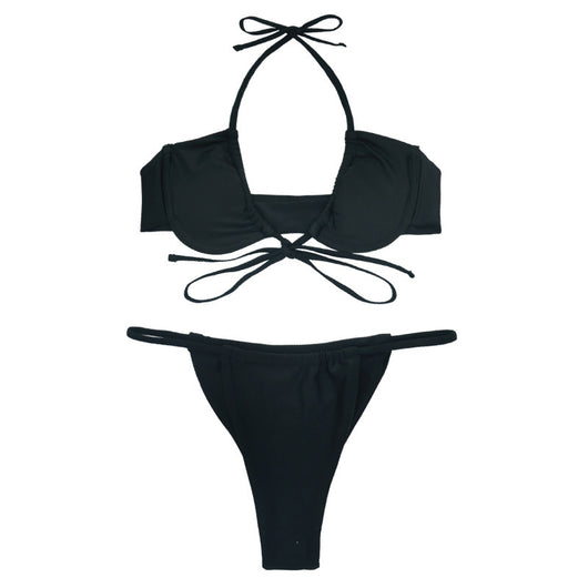 Black two-piece string bikini with a ruched underwire top and matching string bottom, modeled outdoors. - Image 3