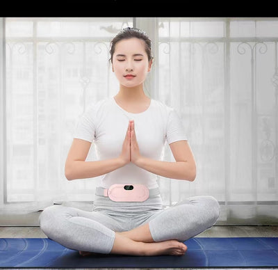 Pink electric stomach warming belt with lumbar support, digital display, and adjustable grey strap on a pink pedestal. - Image 9