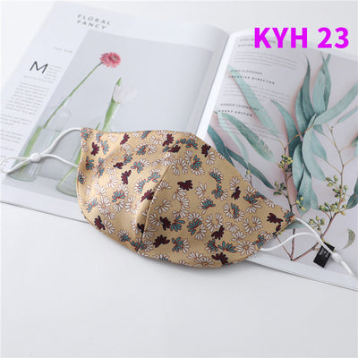 White silk face mask with light blue floral pattern and adjustable ear loops for women's sun protection. - Image 24