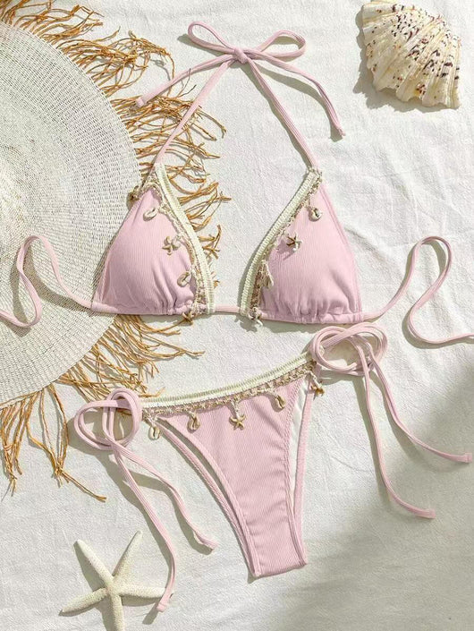Light pink ribbed halterneck bikini with triangle cups and tie-side bottom, adorned with shell and starfish charms. - Image 6