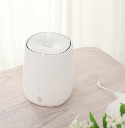 White mini aromatherapy machine with a minimalist design, featuring a top mist outlet and a single control button. - Image 6
