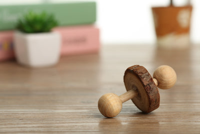 Set of natural wooden hamster toys including dumbbell shapes, a spherical bell toy, and two cylindrical bell toys, with a hamster. - Image 8