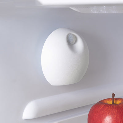 White spherical smart pet deodorizer with a sensor, designed for litter basins, shown against a light gray background with green leaves. - Image 11