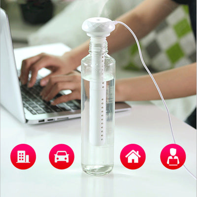 White portable USB humidifier with a columnar body and faceted top, featuring a USB port and control button. - Image 6