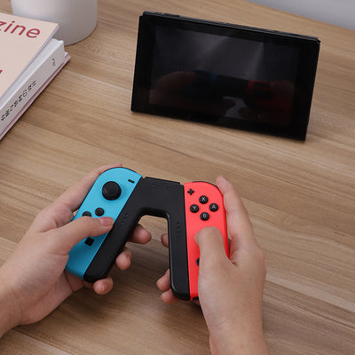 V-shaped charging grip for Nintendo Switch Joy-Cons, featuring a black body with blue and red slots. - Image 10