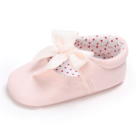 Pink baby soft sole princess shoes with a decorative bow and red polka dot lining, perfect for infants. - Image 2