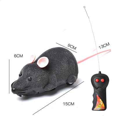 White remote control cat toy mouse with black ears and tail, next to a black remote control with red buttons. - Image 7