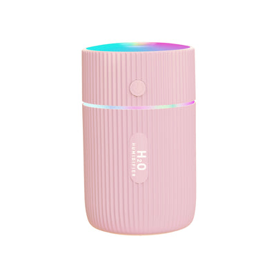 White portable ultrasonic humidifier with ribbed texture, colorful LED lights, and a power button. - Image 8