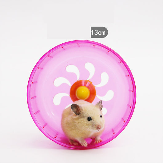 Light brown hamster running in a translucent blue 13cm diameter exercise wheel with a yellow center. - Image 9