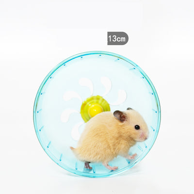 Light brown hamster running in a translucent blue 13cm diameter exercise wheel with a yellow center. - Image 12