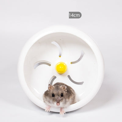 Light brown hamster running in a translucent blue 13cm diameter exercise wheel with a yellow center. - Image 14