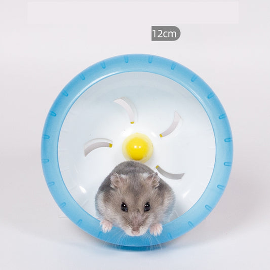 Light brown hamster running in a translucent blue 13cm diameter exercise wheel with a yellow center. - Image 2