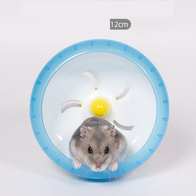 Light brown hamster running in a translucent blue 13cm diameter exercise wheel with a yellow center. - Image 2