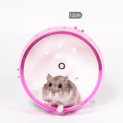 Light brown hamster running in a translucent blue 13cm diameter exercise wheel with a yellow center. - Image 4