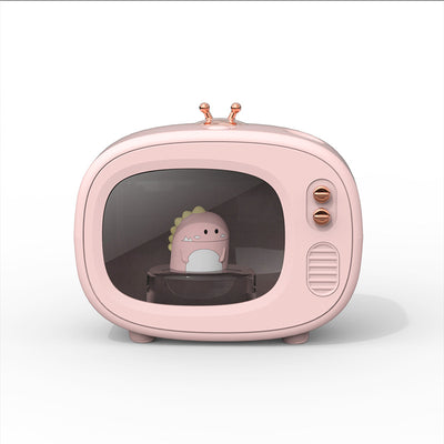 Pink TV-shaped humidifier with a cute dinosaur figurine inside, featuring rose gold accents and a night light. - Image 10