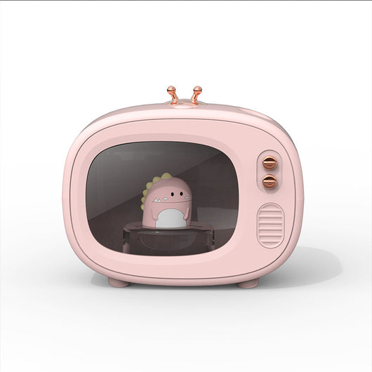 Pink TV-shaped humidifier with a cute dinosaur figurine inside, featuring rose gold accents and a night light. - Image 10