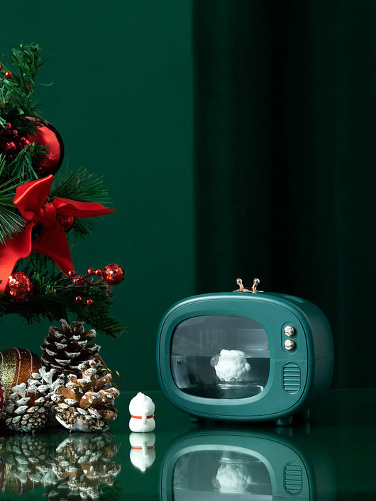 Pink TV-shaped humidifier with a cute dinosaur figurine inside, featuring rose gold accents and a night light. - Image 6