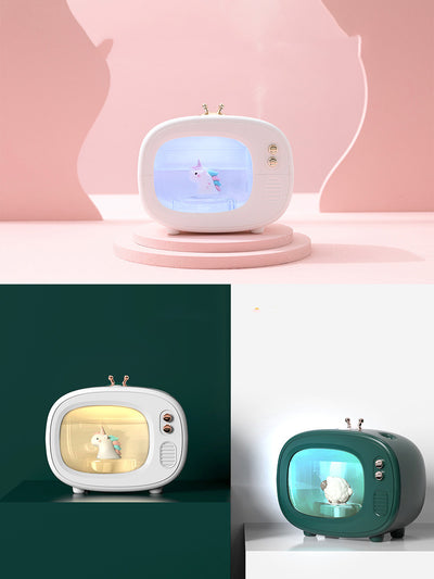 Pink TV-shaped humidifier with a cute dinosaur figurine inside, featuring rose gold accents and a night light. - Image 8
