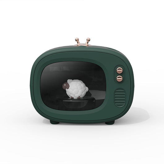 Pink TV-shaped humidifier with a cute dinosaur figurine inside, featuring rose gold accents and a night light. - Image 9