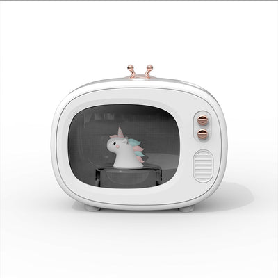 Pink TV-shaped humidifier with a cute dinosaur figurine inside, featuring rose gold accents and a night light. - Image 7