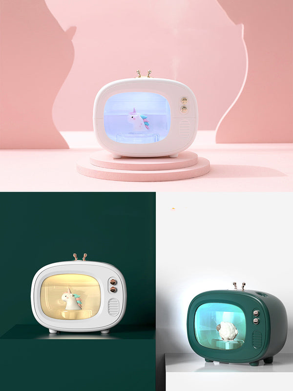 Pink TV-shaped humidifier with a cute dinosaur figurine inside, featuring rose gold accents and a night light.