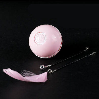White automatic cat toy ball with a power button, shown with detachable feather and bell attachments. - Image 5