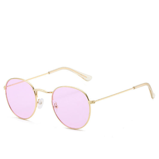 Round gold-framed sunglasses with pink tinted lenses, featuring clear temple tips. - Image 21