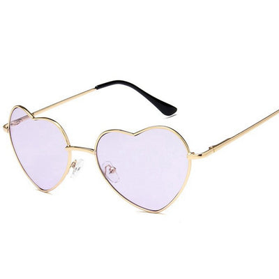 Gold frame heart-shaped sunglasses with transparent yellow lenses and black earpiece tips. - Image 13