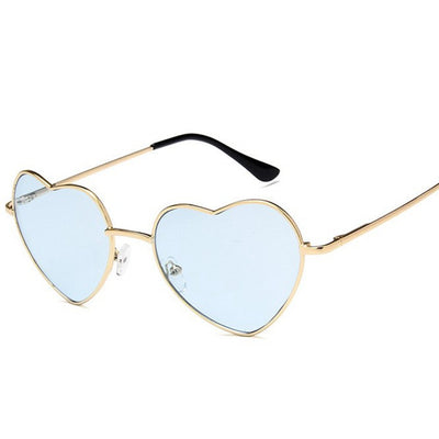 Gold frame heart-shaped sunglasses with transparent yellow lenses and black earpiece tips. - Image 11