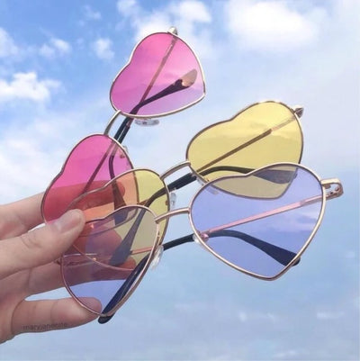 Gold frame heart-shaped sunglasses with transparent yellow lenses and black earpiece tips. - Image 16