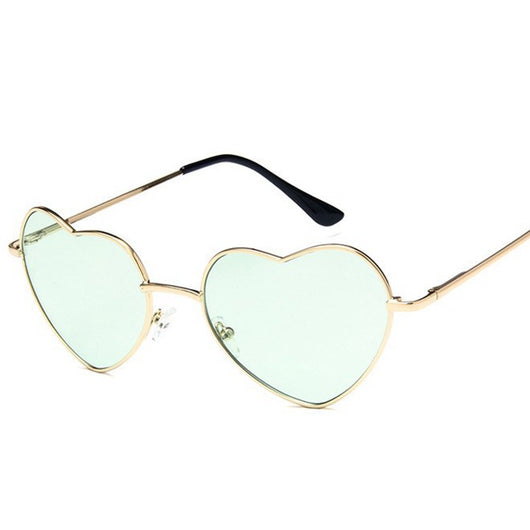 Gold frame heart-shaped sunglasses with transparent yellow lenses and black earpiece tips. - Image 4